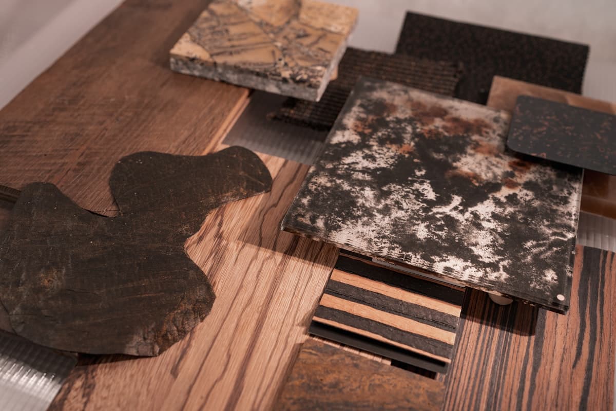 Samples of wood, stone, and metal materials on a workbench